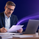 Business professional reviewing documents at a desk, representing document distribution services for UK organisations