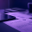 Navy and purple editorial photograph of financial documents and a tablet